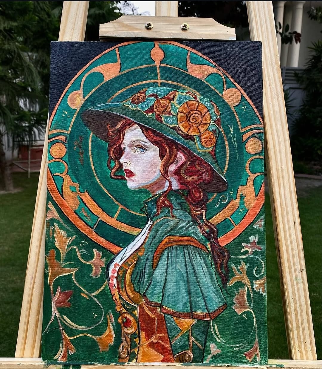 Original painting of a woman in a floral hat against an emerald and gold ornamental background